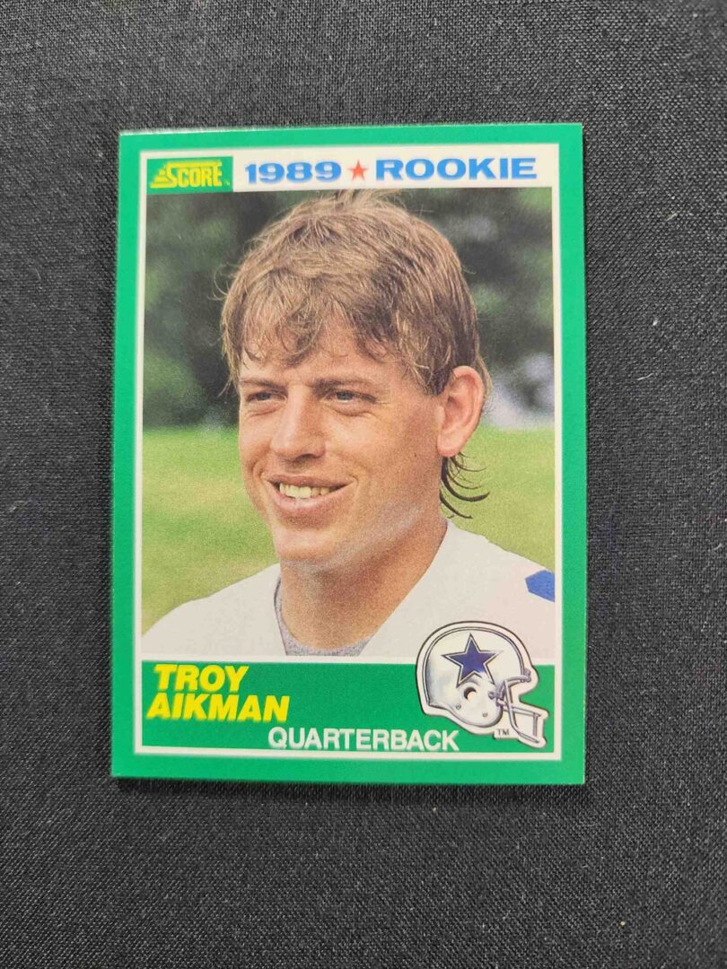 A green card of troy aikman from the 1 9 8 9 nfl rookie season.