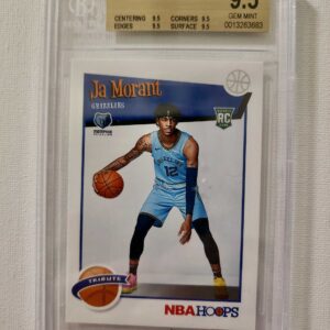 A basketball card is shown in front of a white wall.