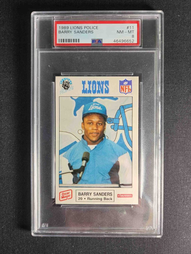 A baseball card of barry sanders is displayed.