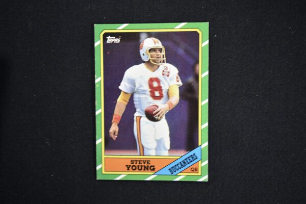 A green and white card with a picture of steve young