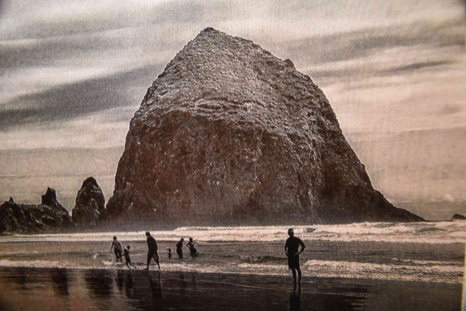 A group of people standing on top of the beach.