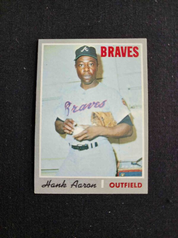 A baseball card of hank aaron with the braves on it.