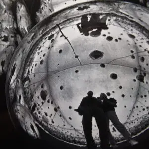 Two people are standing inside a bubble.