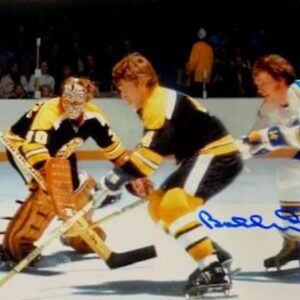 A picture of some hockey players playing on the ice.