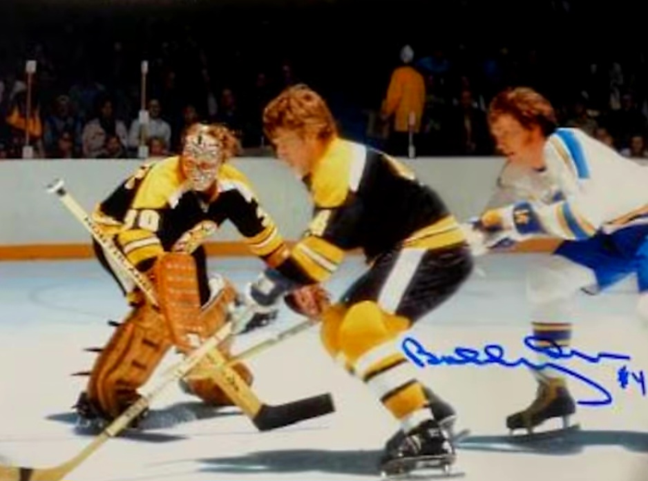 A picture of some hockey players playing on the ice.