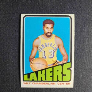 A card of wilt chamberlain in the middle of his basketball court.