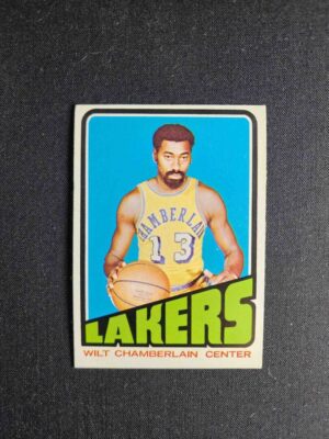 A card of wilt chamberlain in the middle of his basketball court.