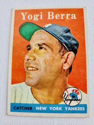 A baseball card of yogi berra is shown.