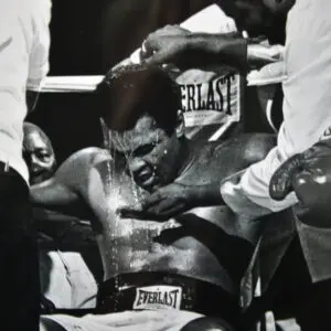 A man in the ring getting his head shaved