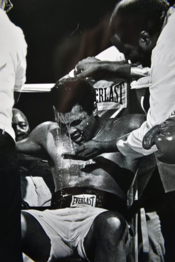 A man in the ring getting his head shaved