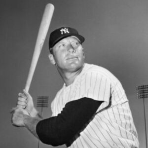 A baseball player holding a bat in his hands.