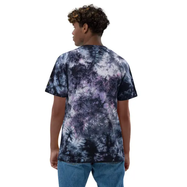 A man wearing a black and white tie dye shirt.