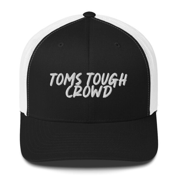 A black and white hat with the words toms tough crowd on it.