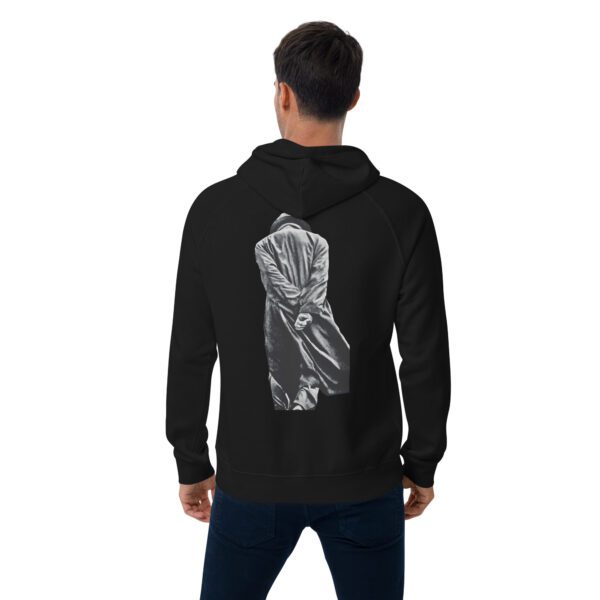 A man wearing a black hoodie with an image of a person 's back.