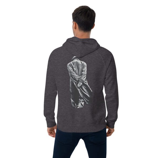 A man wearing a hoodie with an image of a person on it.