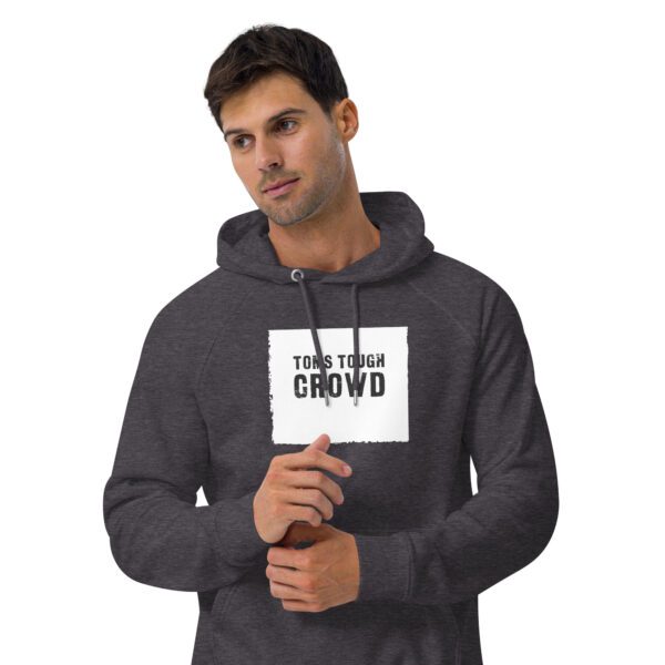 A man wearing a hoodie with a sign on it.