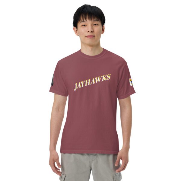 A man wearing a maroon t-shirt with the words " jayhawks ".