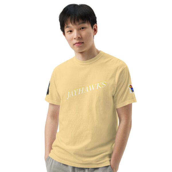 A man wearing a yellow shirt with the word " pittsburgh " on it.