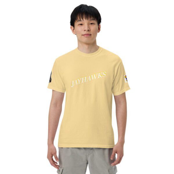 A man wearing a yellow t-shirt with the words " life is short ".