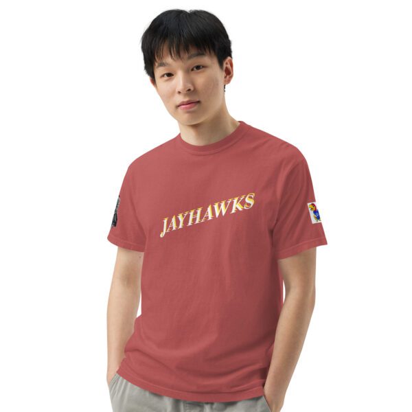 A man wearing a red shirt with the words " jayhawks ".