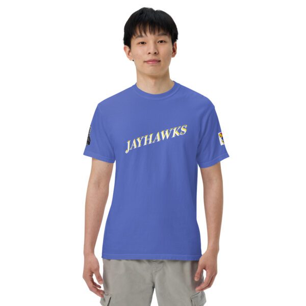 A man wearing a blue shirt with the word jayhawks on it.