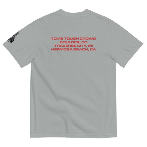 A gray t-shirt with red writing on it.