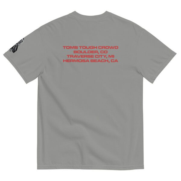 A gray t-shirt with red writing on it.