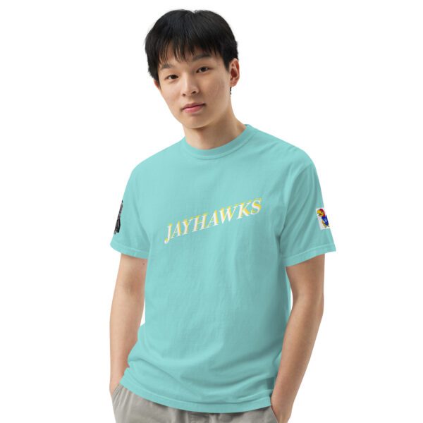 A man wearing a light blue shirt with the words " outlaws ".