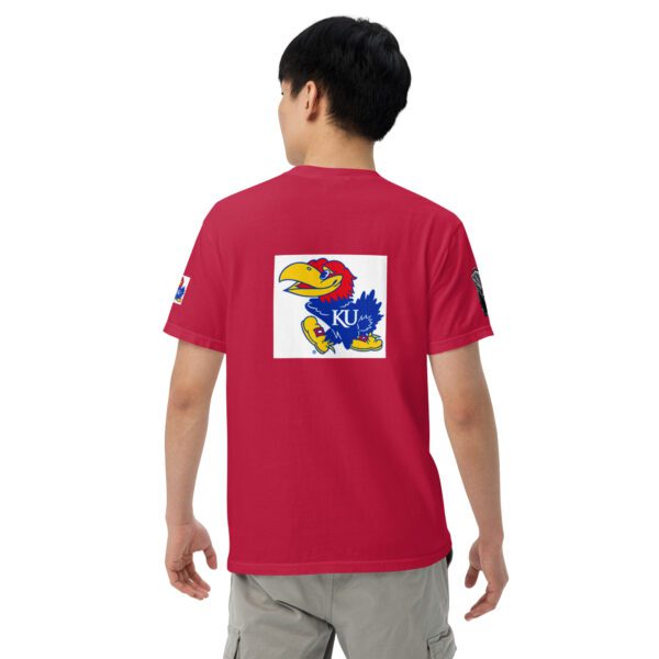 A person wearing a red shirt with an image of the kansas jayhawks on it.