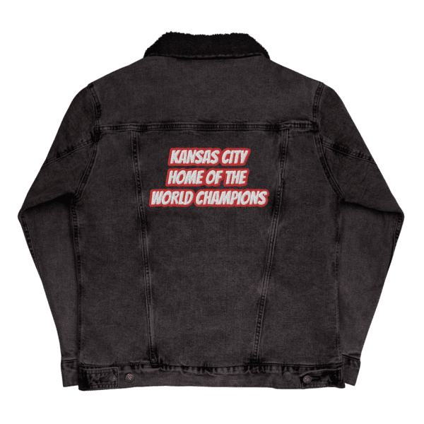 A black jacket with the words kansas city home of the world champions on it.