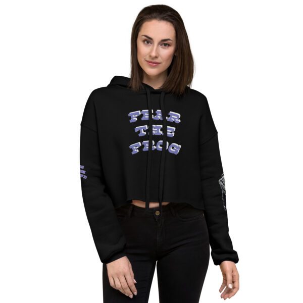 A woman wearing a black hoodie with the words talk to this