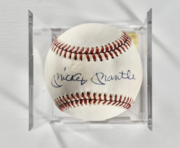 Mickey Mantle signed baseball in case.