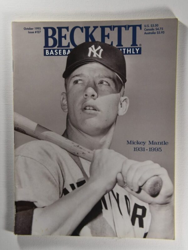 Black and white photo of Mickey Mantle holding a bat.