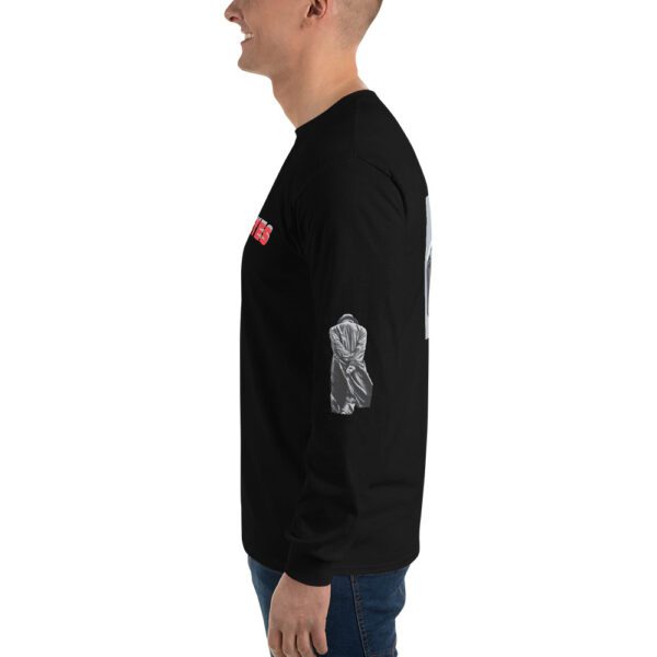 A man wearing a black long sleeve shirt with an image of a person 's arm.