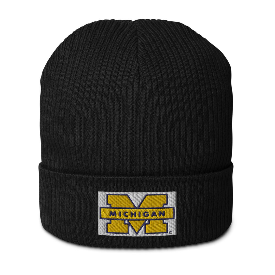 A black knit hat with the university of michigan logo.