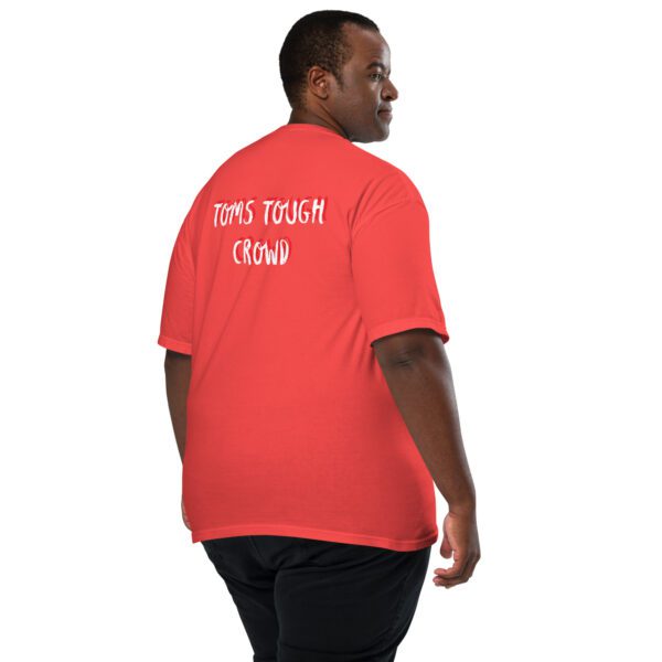 A man wearing an orange shirt with the words " love your friend " written on it.