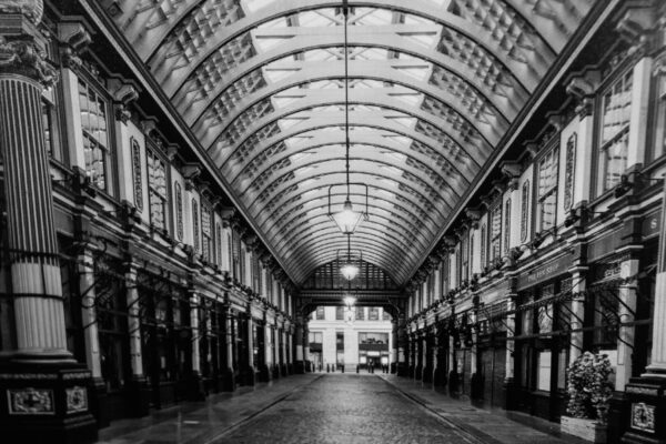 Black and white photo of a covered walkway.