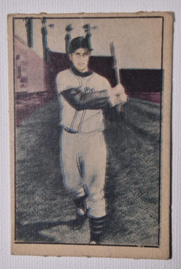 Baseball player holding a bat.