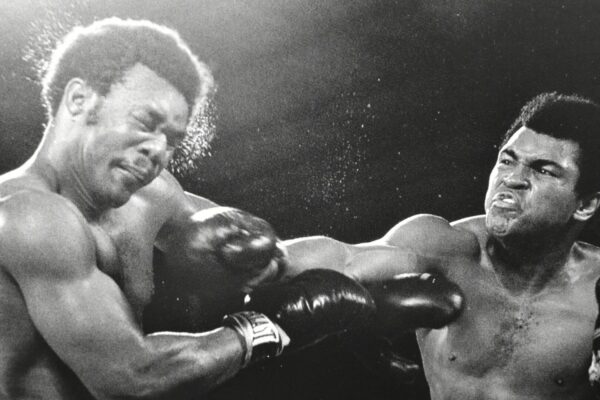 Two boxers in a black and white photo.