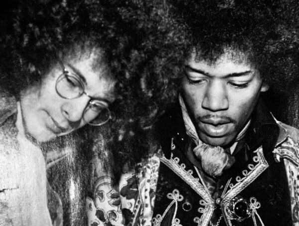 Black and white photo of Jimi Hendrix and a woman.