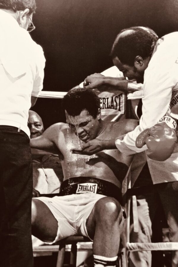 Boxer being doused with water after fight.