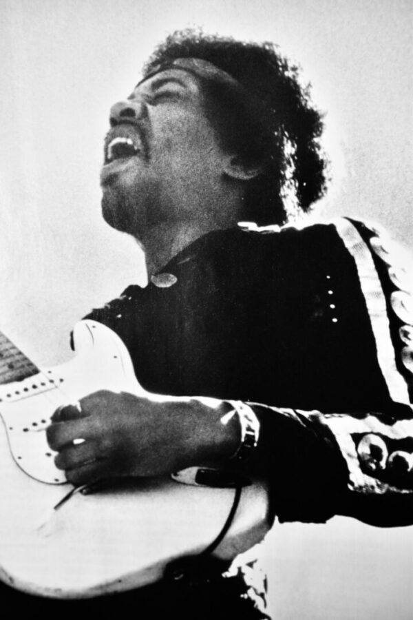 Jimi Hendrix playing electric guitar.