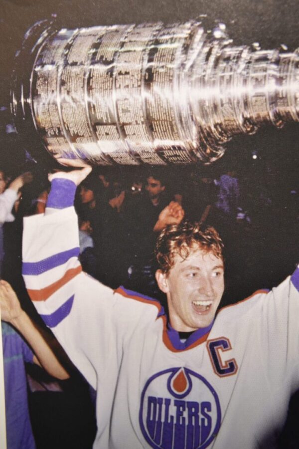 A hockey player holding the Stanley Cup.