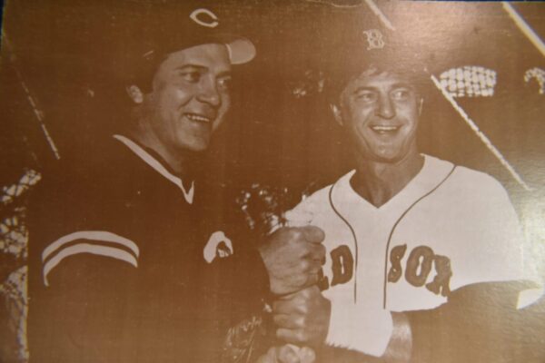 Two baseball players shaking hands.