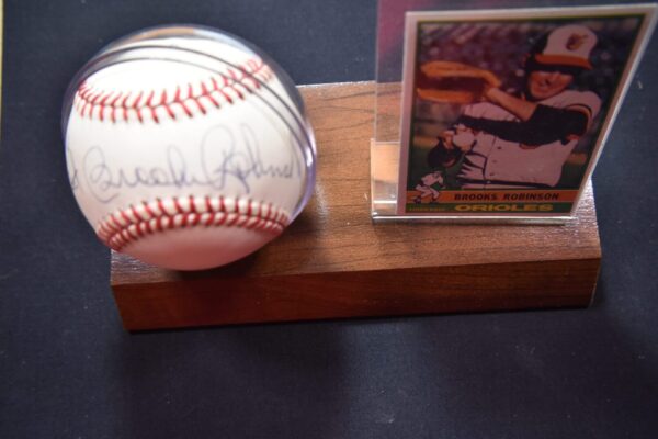 Signed baseball and Brooks Robinson card.