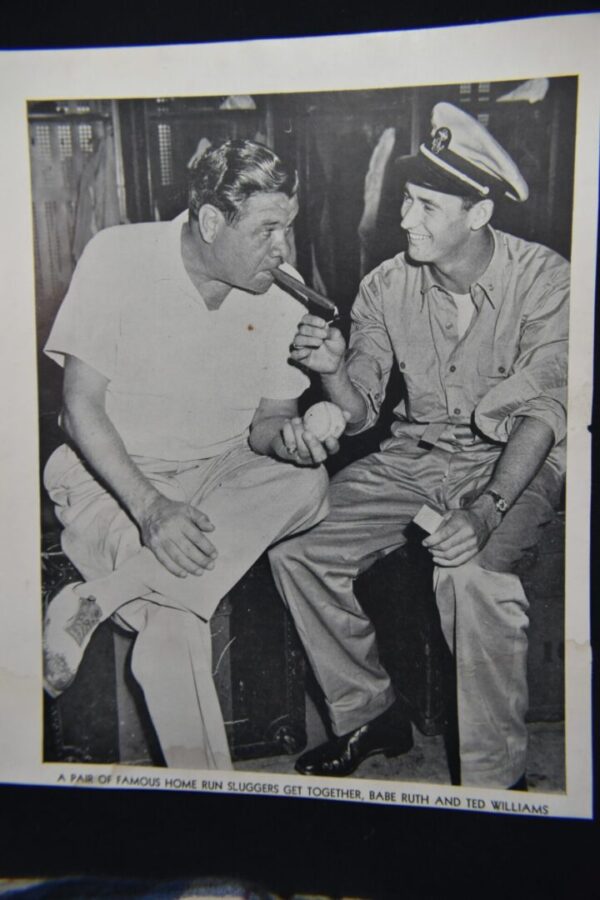 Babe Ruth and Ted Williams with a baseball.