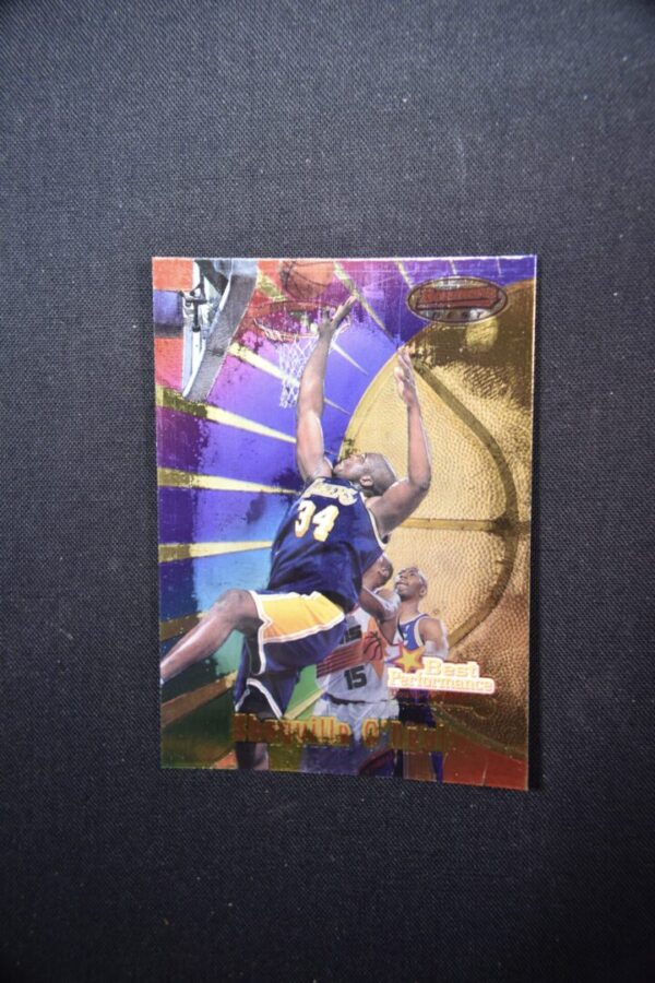 Basketball player dunking with gold foil.