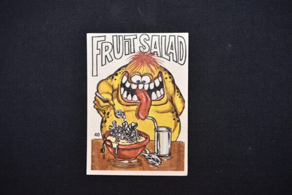 Monster makes fruit salad with nuts.