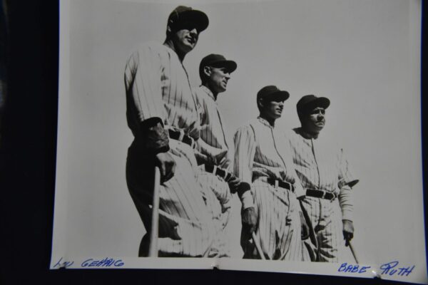 Four baseball players in striped uniforms.