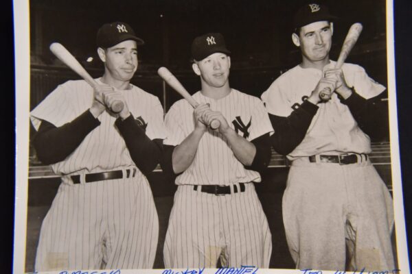 Three New York Yankees baseball players.